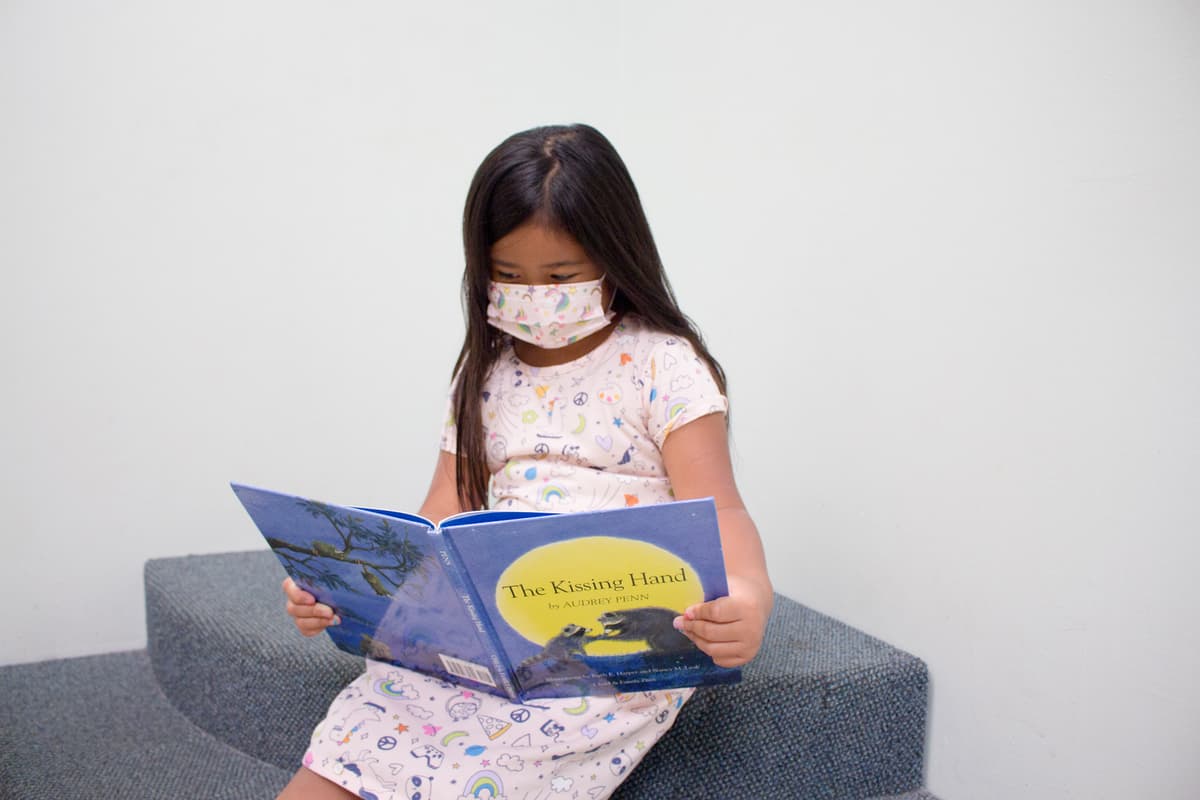 Child reading in waiting area